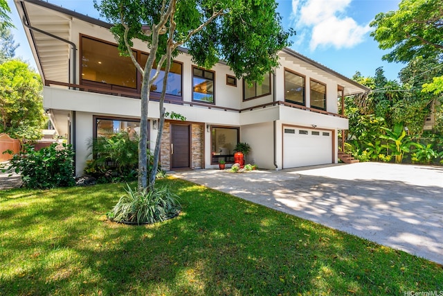 3002 Diamond Head Rd, Honolulu, HI 96815 - view of front facade featuring stucco siding, concrete driveway, a garage, a front yard, and a balcony