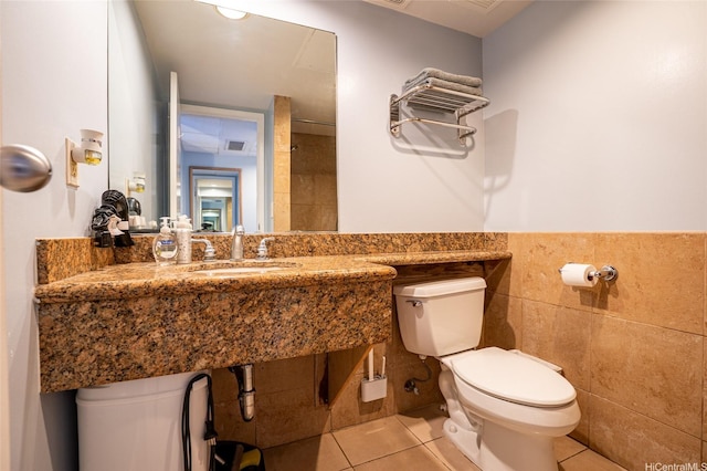 1850 Ala Moana Blvd Unit 603, Honolulu, HI 96815 - bathroom featuring toilet, a sink, and tile patterned floors