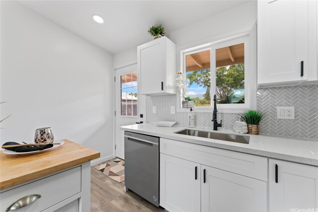 87-888 Waapuhi St, Waianae, HI 96792 - kitchen featuring a sink, stainless steel dishwasher, decorative backsplash, white cabinets, and recessed lighting