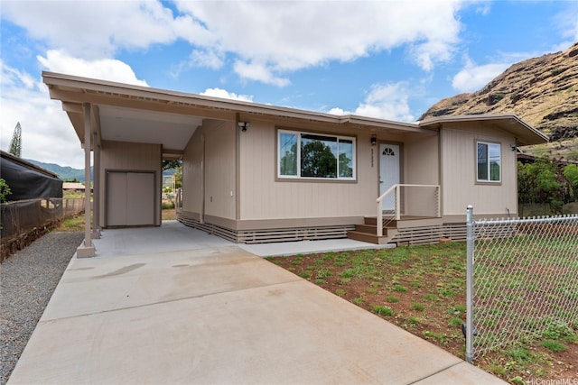 87-888 Waapuhi St, Waianae, HI 96792 - view of front of house featuring fence, concrete driveway, and an attached carport