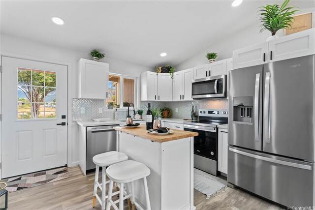 87-888 Waapuhi St, Waianae, HI 96792 - kitchen featuring stainless steel appliances, wooden counters, tasteful backsplash, white cabinetry, and recessed lighting