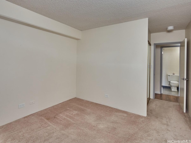 1333 Heulu St Unit 408, Honolulu, HI 96822 - carpeted spare room featuring a textured ceiling