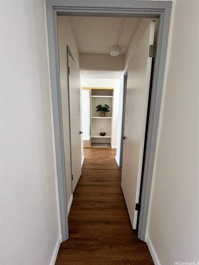 1333 Heulu St Unit 408, Honolulu, HI 96822 - hallway featuring dark wood finished floors and baseboards