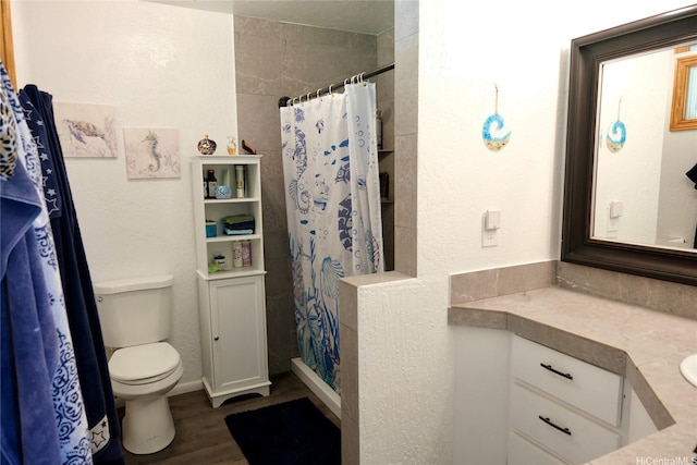 51-416 Kamehameha Hwy Unit A, Kaaawa, HI 96730 - full bathroom featuring toilet, wood finished floors, curtained shower, and vanity