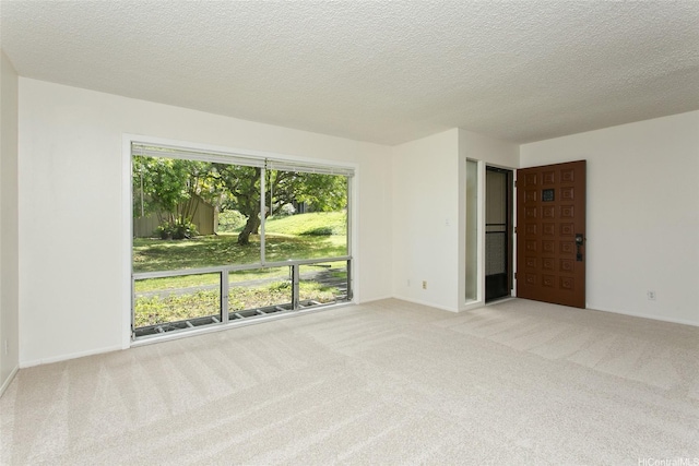 44-3504 Olina St Unit 34, Kaneohe, HI 96744 - spare room featuring carpet, baseboards, and a textured ceiling