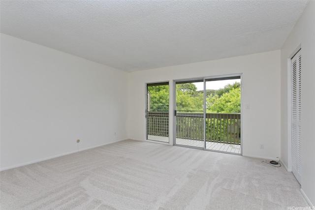 44-3504 Olina St Unit 34, Kaneohe, HI 96744 - spare room with light colored carpet, baseboards, and a textured ceiling