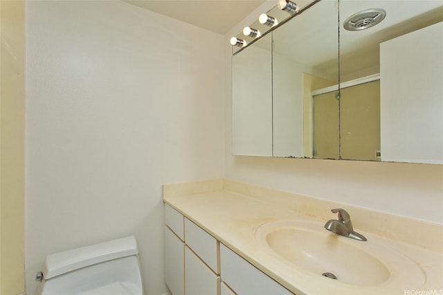 44-3504 Olina St Unit 34, Kaneohe, HI 96744 - bathroom featuring toilet, vanity, and a shower with door