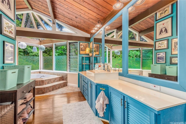 1149 Maunawili Rd, Kailua, HI 96734 - bathroom with vaulted ceiling, wood ceiling, wood finished floors, vanity, and a garden tub