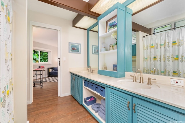 1149 Maunawili Rd, Kailua, HI 96734 - bathroom featuring wood finished floors, double vanity, and baseboards
