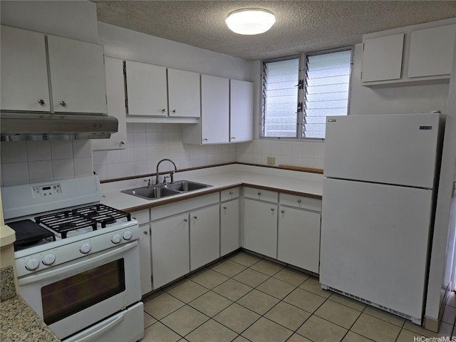 910 Kapahulu Ave Unit 303, Honolulu, HI 96816 - kitchen featuring white appliances, under cabinet range hood, a textured ceiling, a sink, and white cabinetry