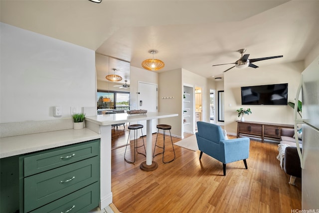 738 Palani Ave Unit 401, Honolulu, HI 96816 - living room featuring ceiling fan and light wood finished floors