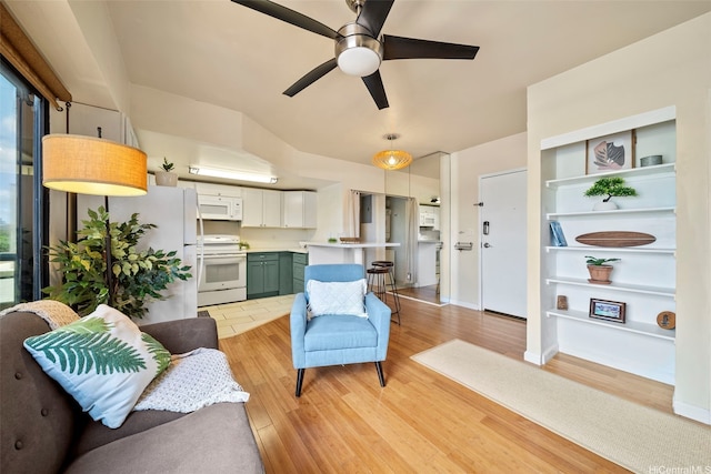738 Palani Ave Unit 401, Honolulu, HI 96816 - living room with light wood finished floors, ceiling fan, baseboards, and built in shelves