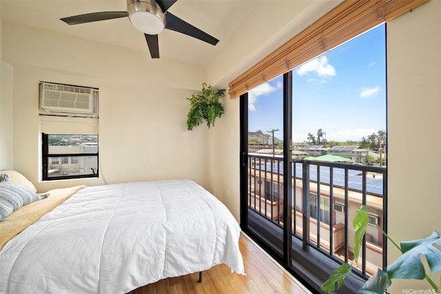 738 Palani Ave Unit 401, Honolulu, HI 96816 - bedroom featuring access to outside, wood finished floors, a wall unit AC, and a ceiling fan