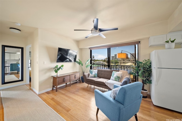 738 Palani Ave Unit 401, Honolulu, HI 96816 - living room featuring light wood-style flooring, ceiling fan, and baseboards