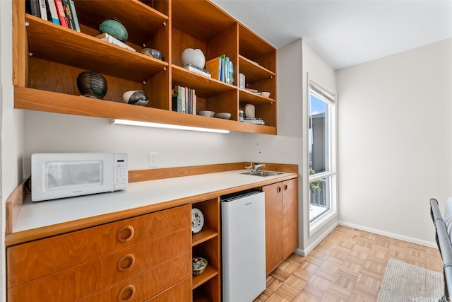 521 Prospect St, Honolulu, HI 96813 - kitchen with refrigerator, open shelves, white microwave, a sink, and healthy amount of natural light
