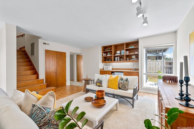 521 Prospect St, Honolulu, HI 96813 - living area with stairway and light wood-style flooring