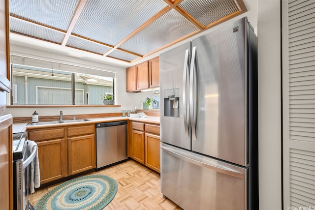 521 Prospect St, Honolulu, HI 96813 - kitchen featuring stainless steel appliances, a sink, light countertops, and brown cabinets