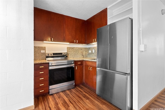 94-249 Waikele Rd Unit A304, Waipahu, HI 96797 - kitchen with stainless steel appliances, dark wood-style flooring, light stone countertops, and a textured ceiling