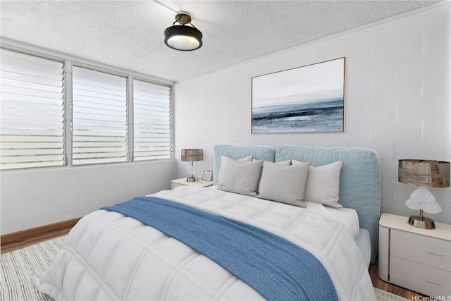 94-249 Waikele Rd Unit A304, Waipahu, HI 96797 - bedroom with a textured ceiling and wood finished floors