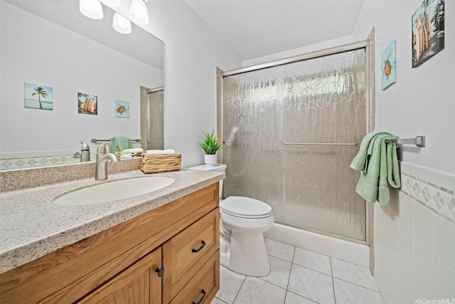 94-860 Kuhaulua St, Waipahu, HI 96797 - full bathroom featuring vanity, toilet, a shower stall, and tile walls