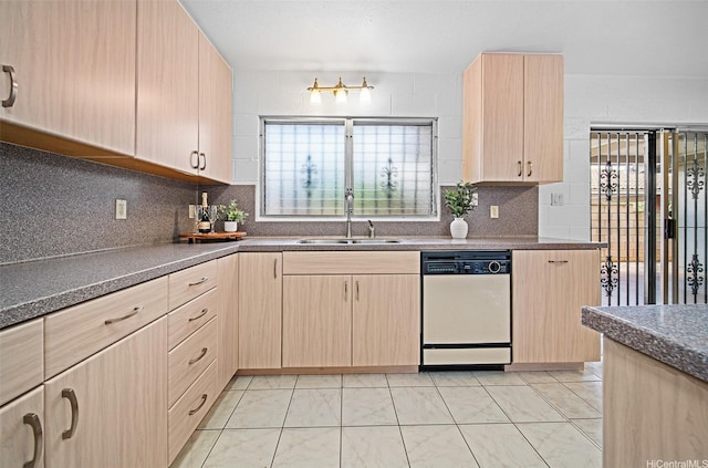 94-860 Kuhaulua St, Waipahu, HI 96797 - kitchen featuring white dishwasher, a sink, light brown cabinets, decorative backsplash, and dark countertops