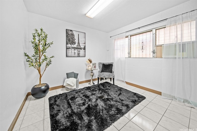 94-860 Kuhaulua St, Waipahu, HI 96797 - living area featuring baseboards, a textured ceiling, and light tile patterned floors
