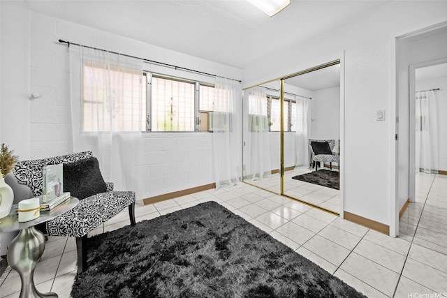 94-860 Kuhaulua St, Waipahu, HI 96797 - tiled living room featuring baseboards