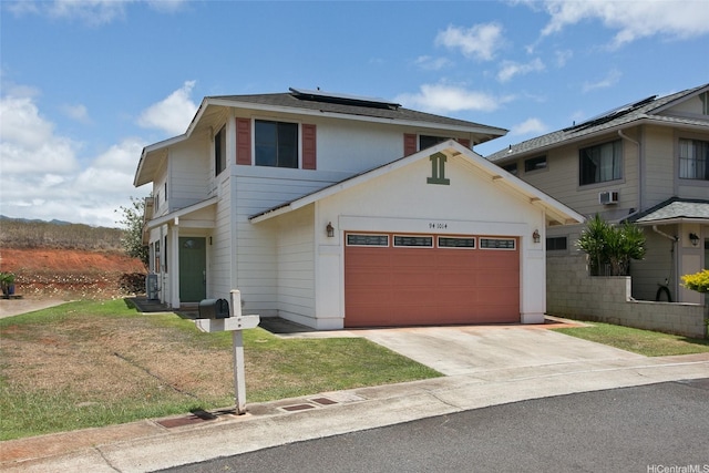 94-1014 Makakoa Loop, Waipahu, HI 96797 - traditional-style house with solar panels, an attached garage, concrete driveway, and a front yard