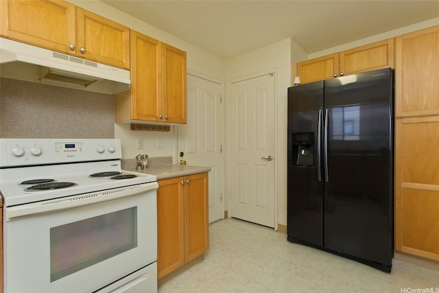 94-1014 Makakoa Loop, Waipahu, HI 96797 - kitchen featuring black fridge with ice dispenser, white electric range oven, under cabinet range hood, light flooring, and light countertops