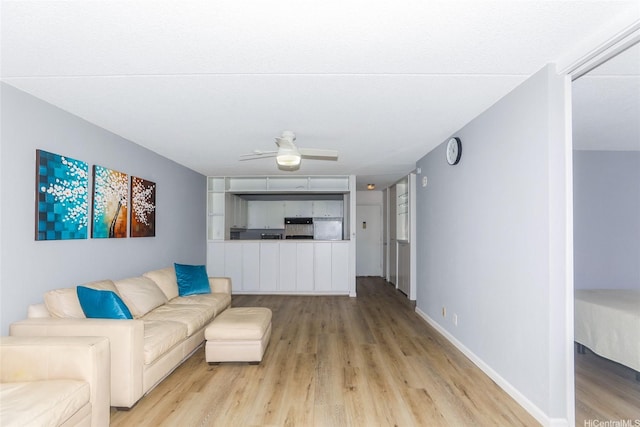 400 Hobron Ln Unit 1109, Honolulu, HI 96815 - living room featuring light wood-type flooring and a ceiling fan