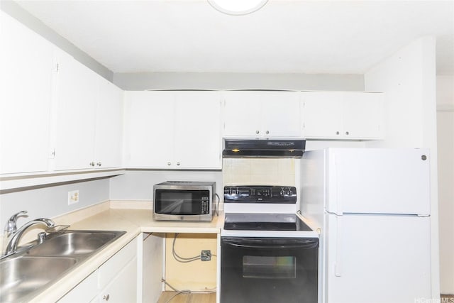 400 Hobron Ln Unit 1109, Honolulu, HI 96815 - kitchen featuring black range with electric cooktop, stainless steel microwave, freestanding refrigerator, under cabinet range hood, and a sink