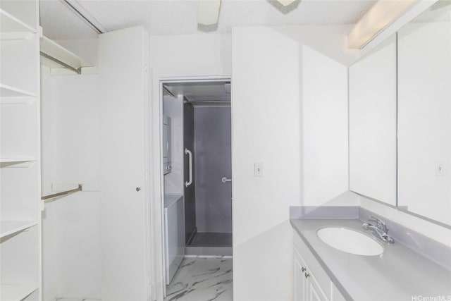 400 Hobron Ln Unit 1109, Honolulu, HI 96815 - full bath featuring vanity, marble finish floors, stacked washing machine and dryer, and a shower