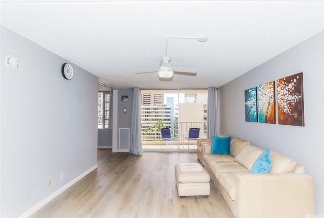 400 Hobron Ln Unit 1109, Honolulu, HI 96815 - living area with ceiling fan and light wood-style floors