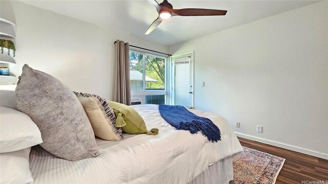 95-786 Wikao St Unit M103, Mililani, HI 96789 - bedroom featuring wood finished floors and a ceiling fan