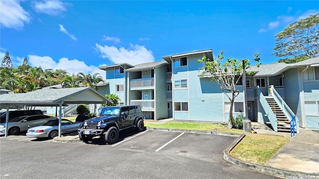 95-786 Wikao St Unit M103, Mililani, HI 96789 - view of property featuring covered and uncovered parking and stairway
