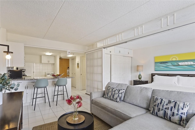 1777 Ala Moana Blvd Unit 1517, Honolulu, HI 96815 - living room with light tile patterned floors and a textured ceiling