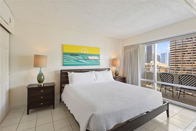1777 Ala Moana Blvd Unit 1517, Honolulu, HI 96815 - tiled bedroom featuring a textured ceiling and a closet