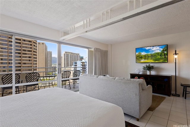 1777 Ala Moana Blvd Unit 1517, Honolulu, HI 96815 - bedroom featuring access to exterior, light tile patterned floors, and a textured ceiling