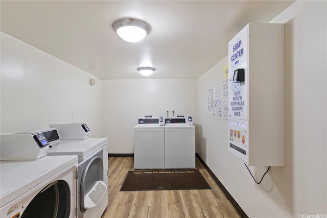 1777 Ala Moana Blvd Unit 1517, Honolulu, HI 96815 - community laundry room featuring independent washer and dryer and light wood-type flooring