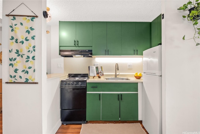 1060 Kamehameha Hwy Unit 2901A, Pearl City, HI 96782 - kitchen with black range with electric cooktop, a sink, under cabinet range hood, freestanding refrigerator, and light countertops
