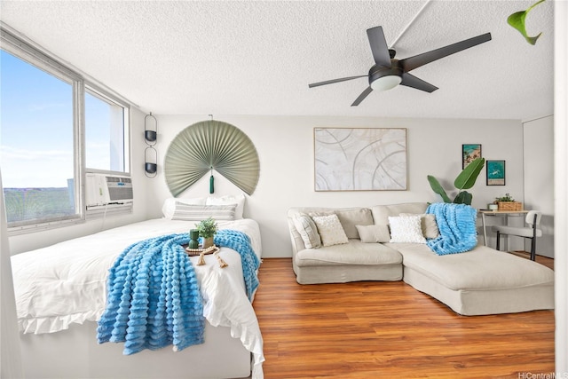 1060 Kamehameha Hwy Unit 2901A, Pearl City, HI 96782 - living area with a textured ceiling, wood finished floors, a ceiling fan, and cooling unit