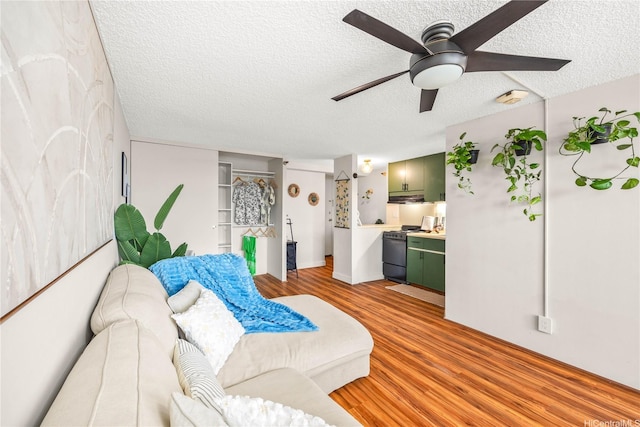 1060 Kamehameha Hwy Unit 2901A, Pearl City, HI 96782 - living room featuring a textured ceiling, light wood finished floors, and a ceiling fan