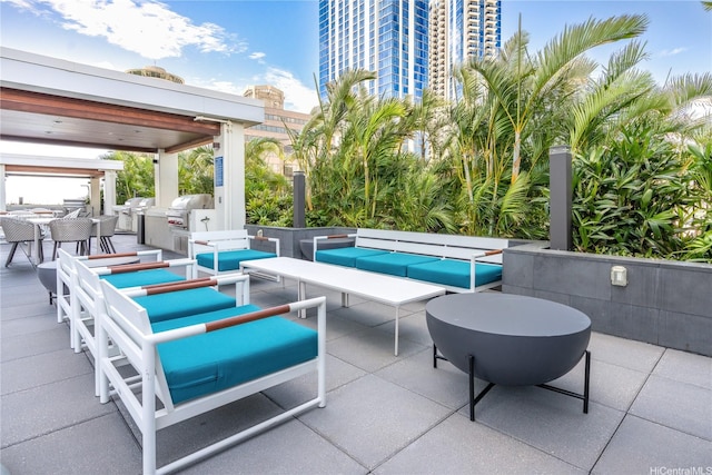 629 Keeaumoku St Unit 2505, Honolulu, HI 96814 - view of patio with outdoor lounge area, exterior kitchen, outdoor dining area, and grilling area