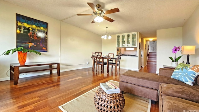 98-1451 Kaahumanu St Unit B218, Aiea, HI 96701 - living area with ceiling fan, a chandelier, wood finished floors, a textured ceiling, and vaulted ceiling