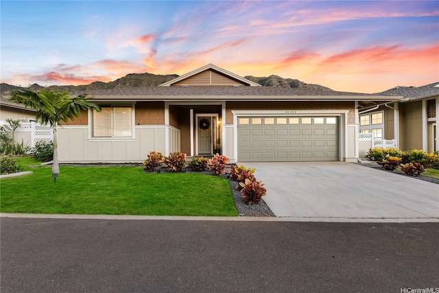 84-814 Maiola St Unit 39, Waianae, HI 96792 - ranch-style home with a garage, driveway, a lawn, board and batten siding, and a mountain view