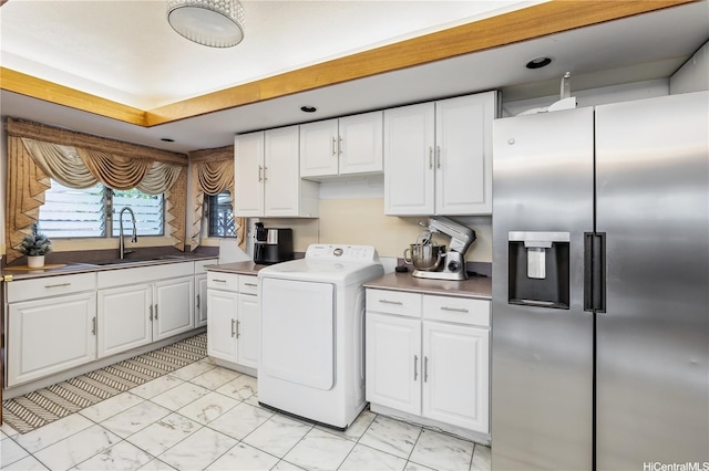 94-1090 Kuhaulua St, Waipahu, HI 96797 - kitchen featuring stainless steel refrigerator with ice dispenser, washer / dryer, a sink, and white cabinetry