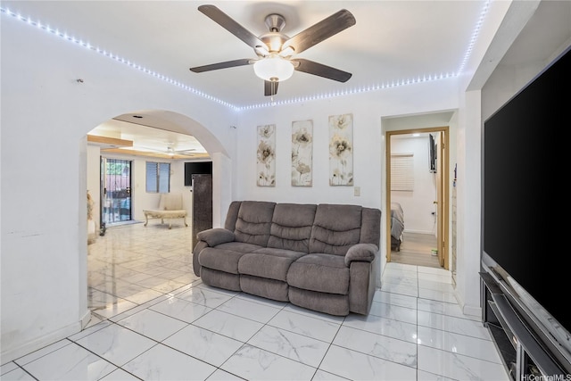 94-1090 Kuhaulua St, Waipahu, HI 96797 - living area featuring ceiling fan, arched walkways, and light marble finish flooring