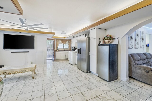 94-1090 Kuhaulua St, Waipahu, HI 96797 - kitchen featuring freestanding refrigerator, high end refrigerator, light marble finish floors, washer / dryer, and arched walkways