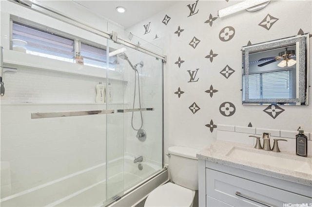 94-1090 Kuhaulua St, Waipahu, HI 96797 - bathroom featuring bath / shower combo with glass door, vanity, and plenty of natural light