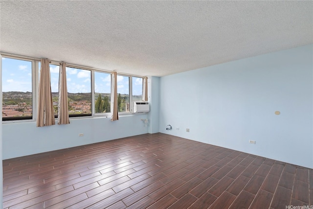 98-288 Kaonohi St Unit 1107, Aiea, HI 96701 - empty room with dark wood-style flooring and a textured ceiling